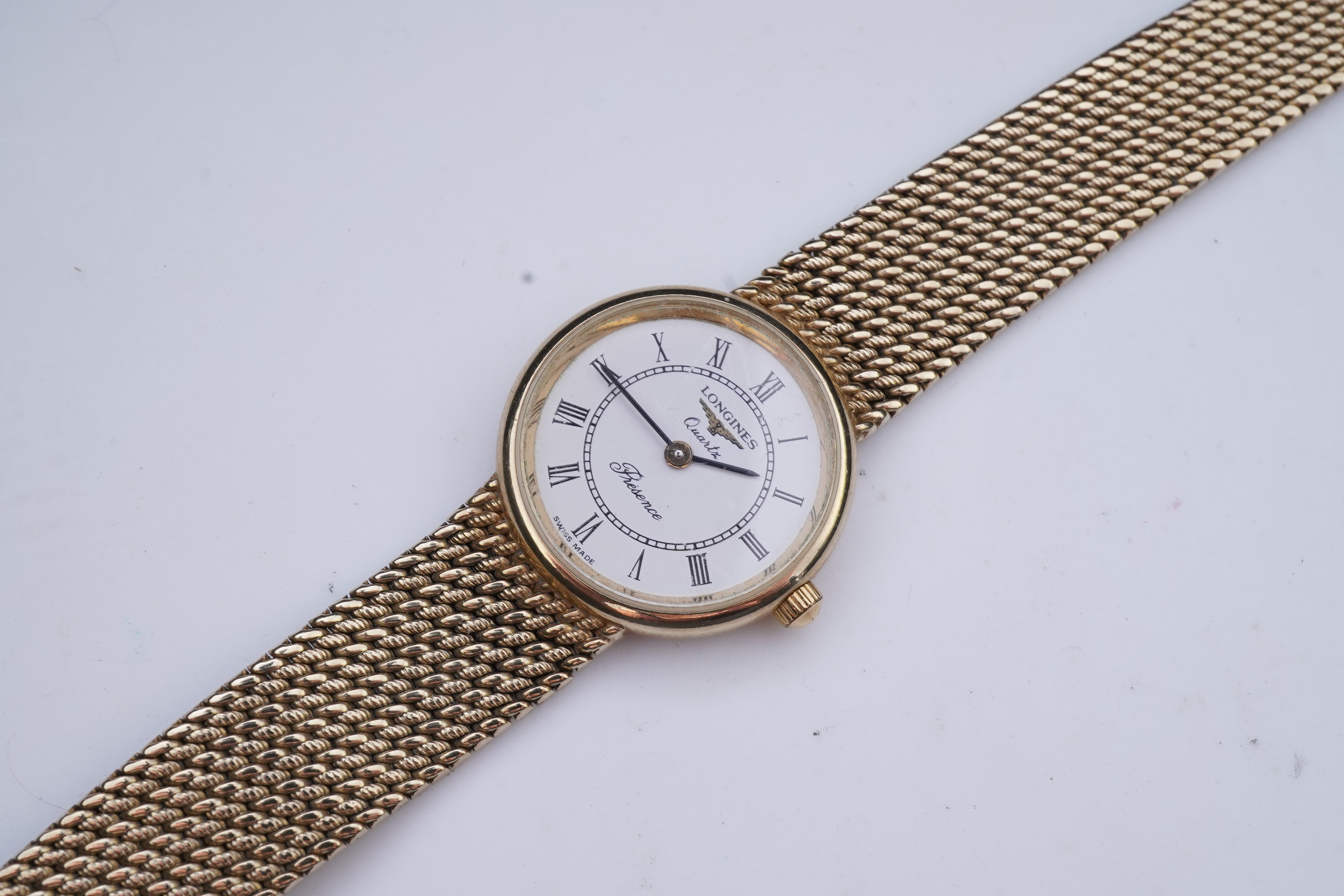 Longines, a gold watch
